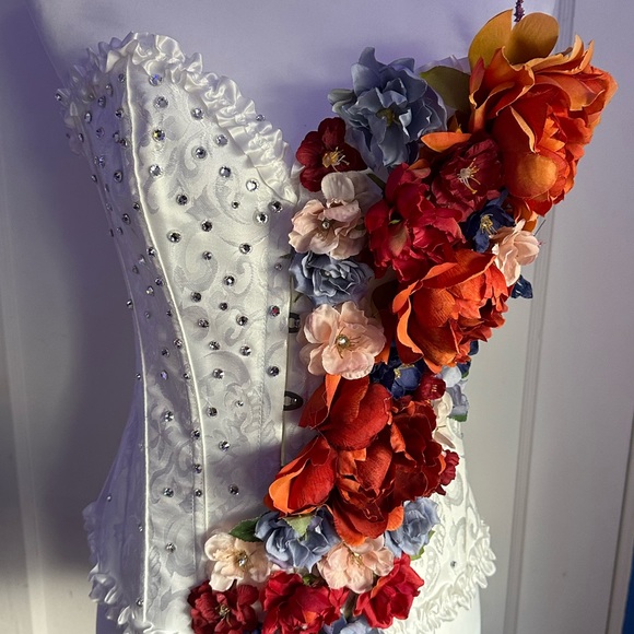 white custom rave corset with orange, blue, pink, and red...